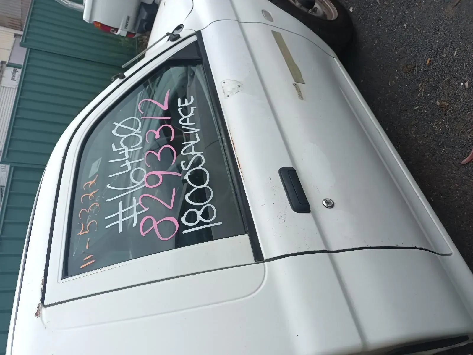 White Van With Markings on the Window, Parked Outdoors — South West 4WD Wreckers In Brisbane, QLD