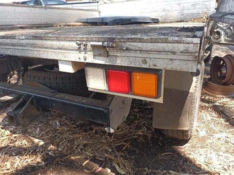 The Back of a Truck is Sitting on the Ground — South West 4WD Wreckers In Harristown, QLD