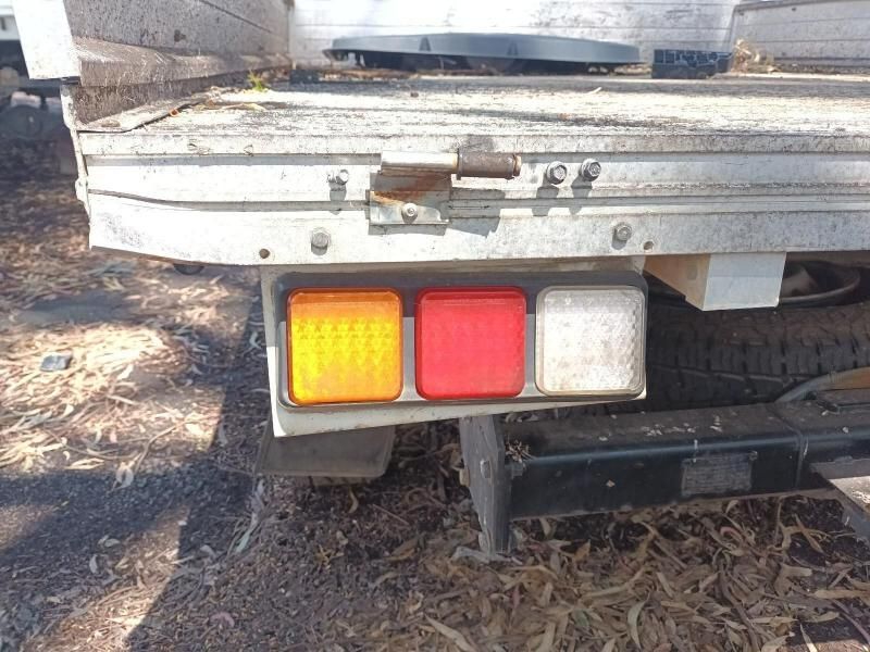 A Close Up of a Truck 's Tail Light on a Dirt Road — South West 4WD Wreckers In Harristown, QLD