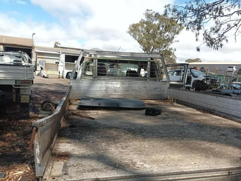 A Row of Trucks Are Parked in a Parking Lot — South West 4WD Wreckers In Harristown, QLD