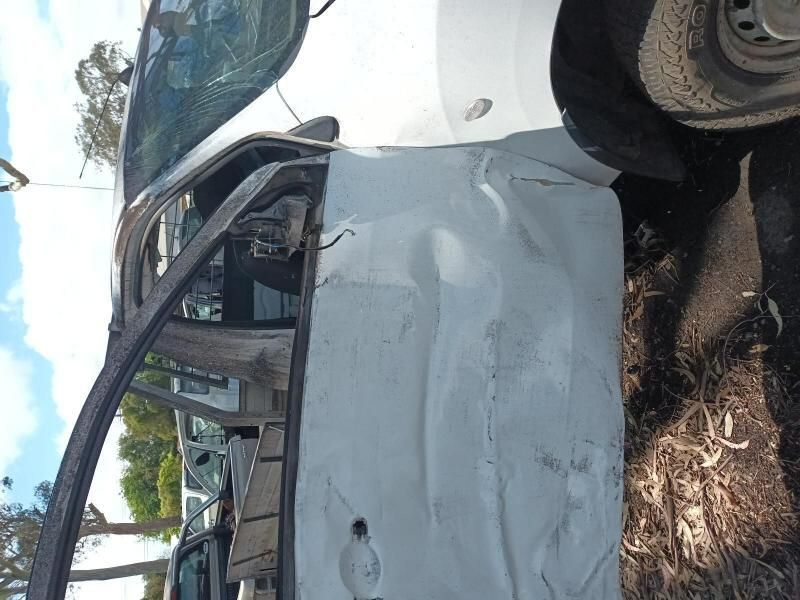 A White Car With the Door Open is Sitting on the Ground — South West 4WD Wreckers In Harristown, QLD
