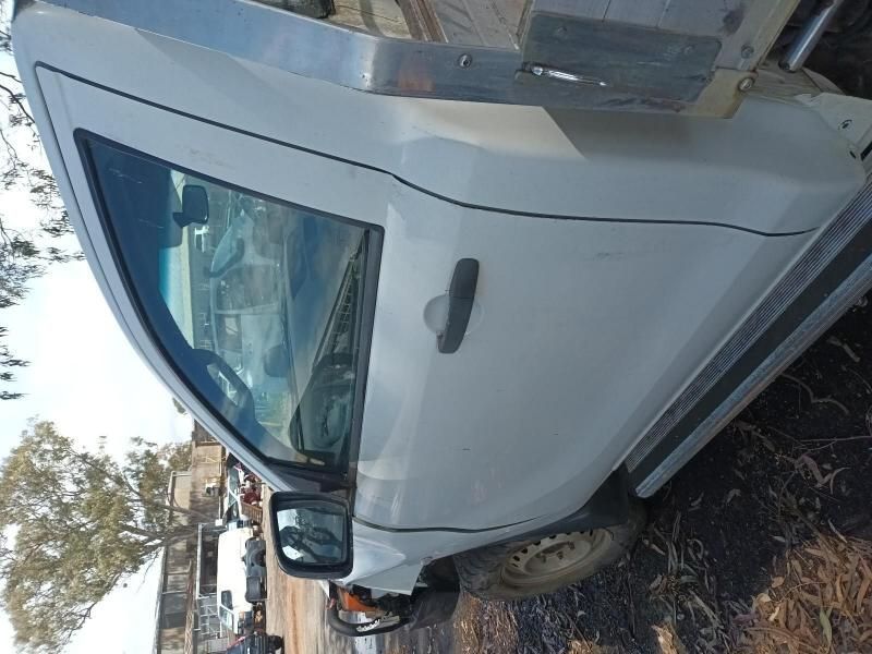 A White Truck is Parked on a Dirt Road — South West 4WD Wreckers In Harristown, QLD