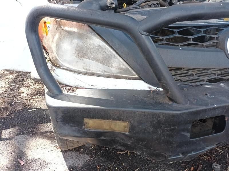 A Close Up of a Car 's Front Bumper and Headlight — South West 4WD Wreckers In Harristown, QLD