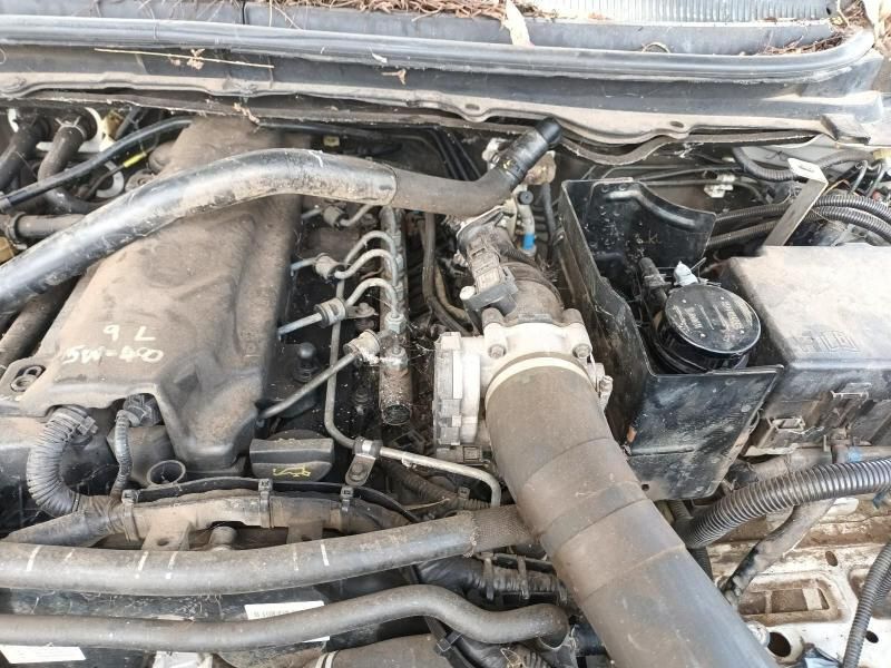 A Close Up of a Car Engine With a Hose Coming Out of It — South West 4WD Wreckers In Harristown, QLD