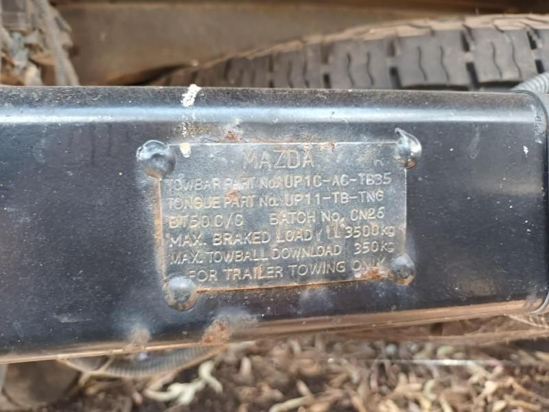 A Close Up of a Mazda Trailer With a Label on It — South West 4WD Wreckers In Harristown, QLD