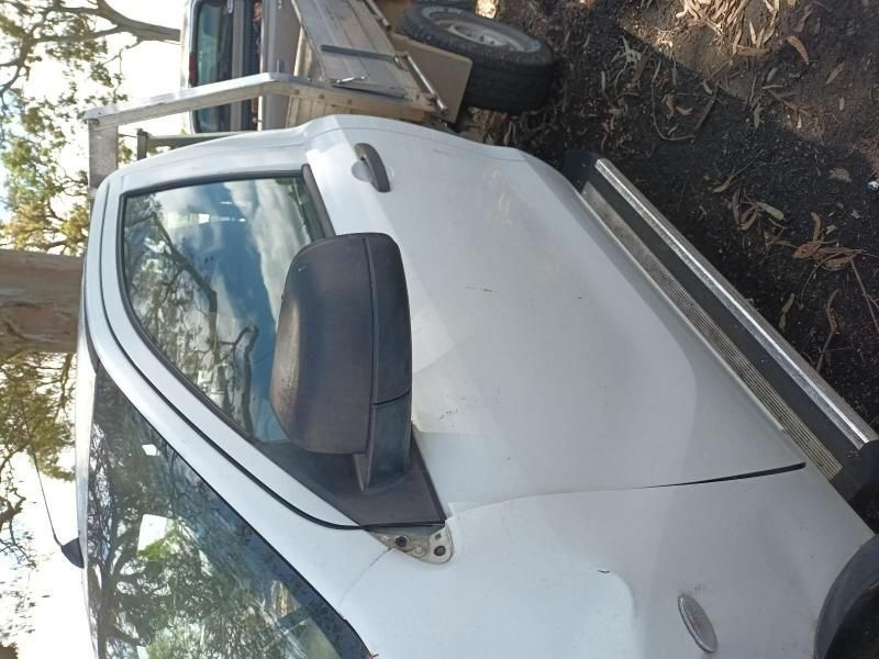 A White Truck is Parked on the Side of the Road — South West 4WD Wreckers In Harristown, QLD