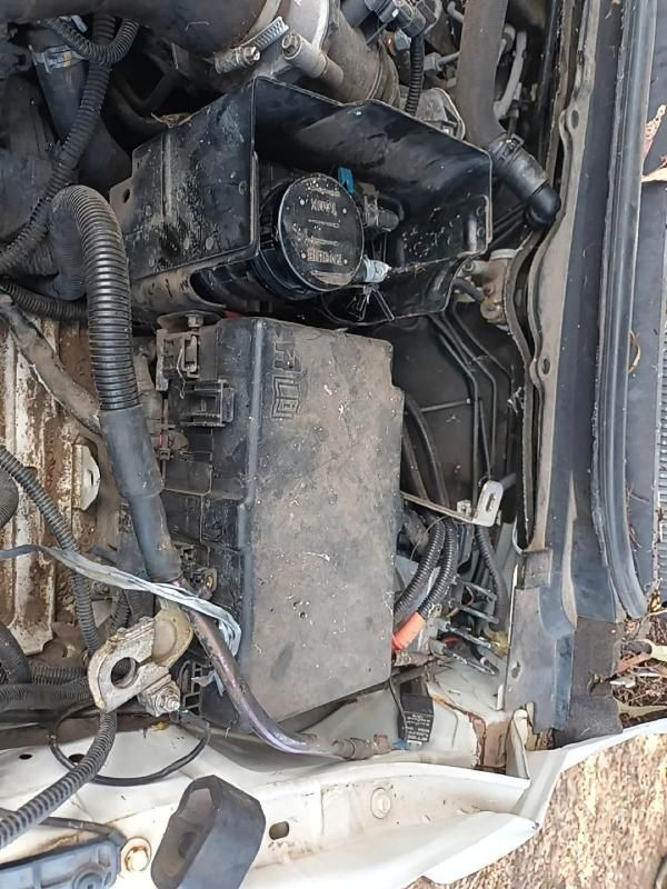 A Close Up of a Car Engine With a Fan and a Fuse Box — South West 4WD Wreckers In Harristown, QLD