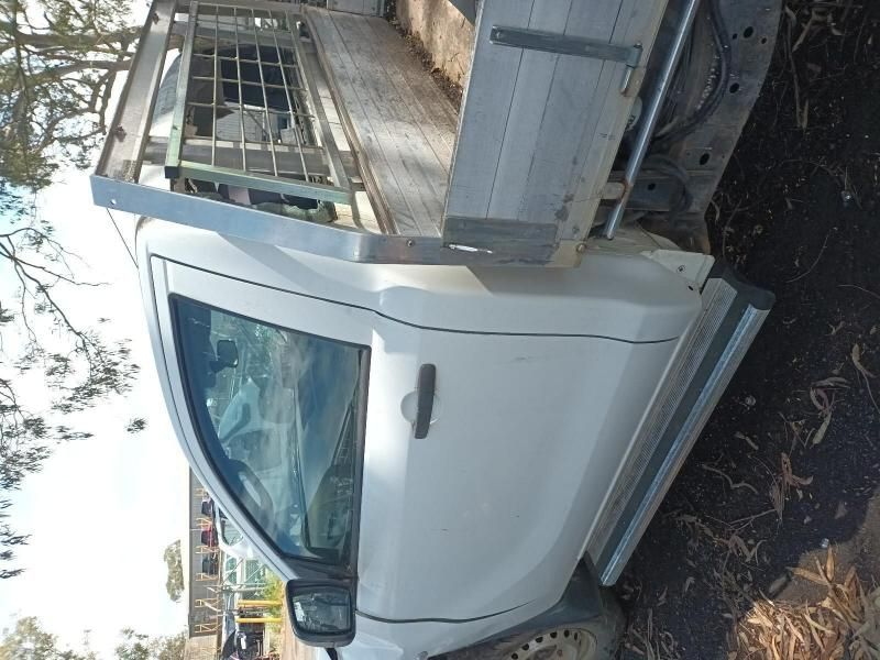 A White Truck is Parked on the Side of the Road — South West 4WD Wreckers In Harristown, QLD