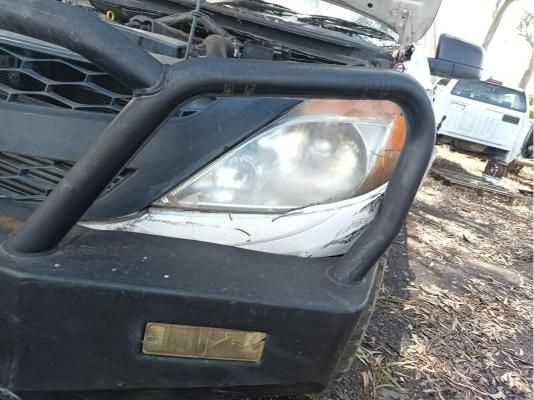 A Close Up of a Car 's Headlight With a Bumper on It — South West 4WD Wreckers In Harristown, QLD