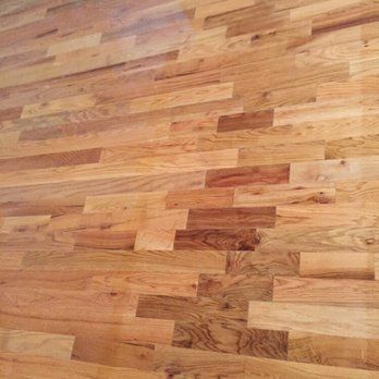Wooden parquet floor in various shades of tan and brown.