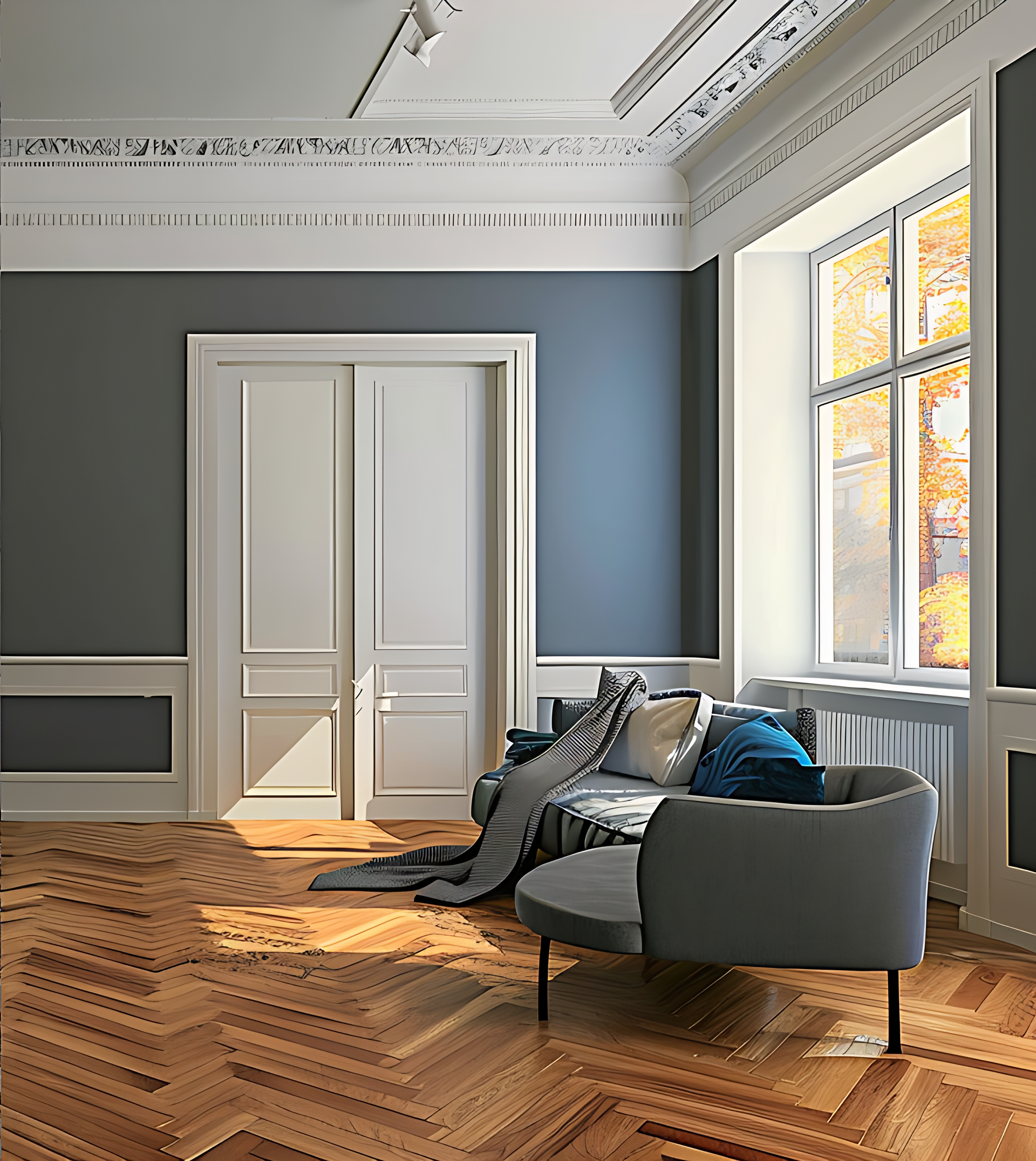 A room with gray walls, white trim, and a parquet floor. A sofa, a chair, and a window with fall foliage are visible.