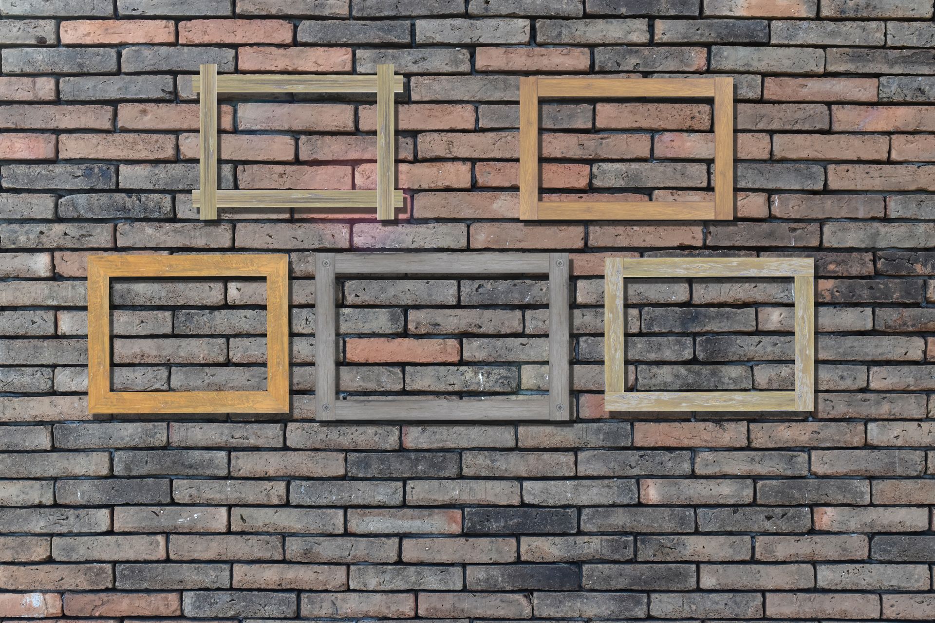 Five empty square frames in various colors on a brick wall.
