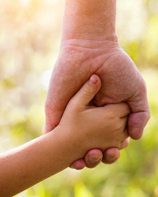 Holding Hand with a Father and Child — Hanover, PA — Strausbaugh Law PLLC