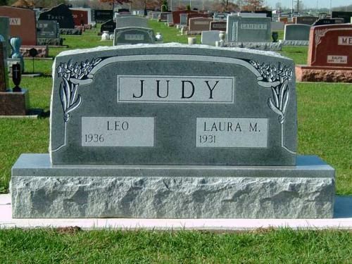 A gravestone in a cemetery that says judy on it