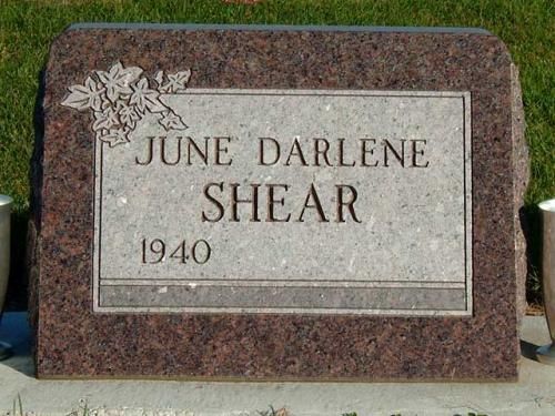 A gravestone for june darlene shear in a cemetery