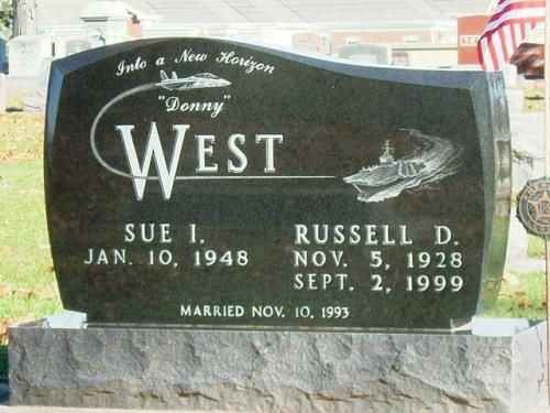 A gravestone with the name west on it