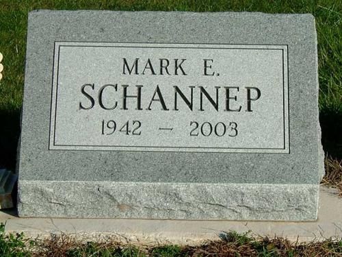 A gravestone for mark e. schannep in a cemetery.