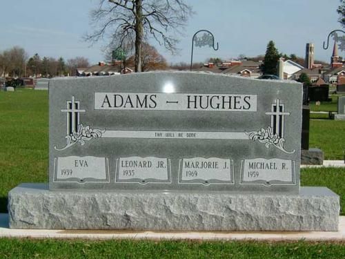 A gravestone for adams and hughes in a cemetery