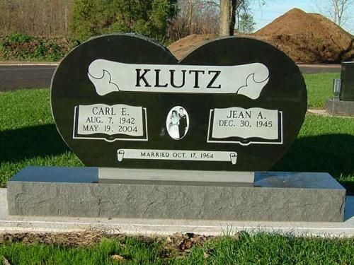 A heart shaped gravestone with the name klutz on it