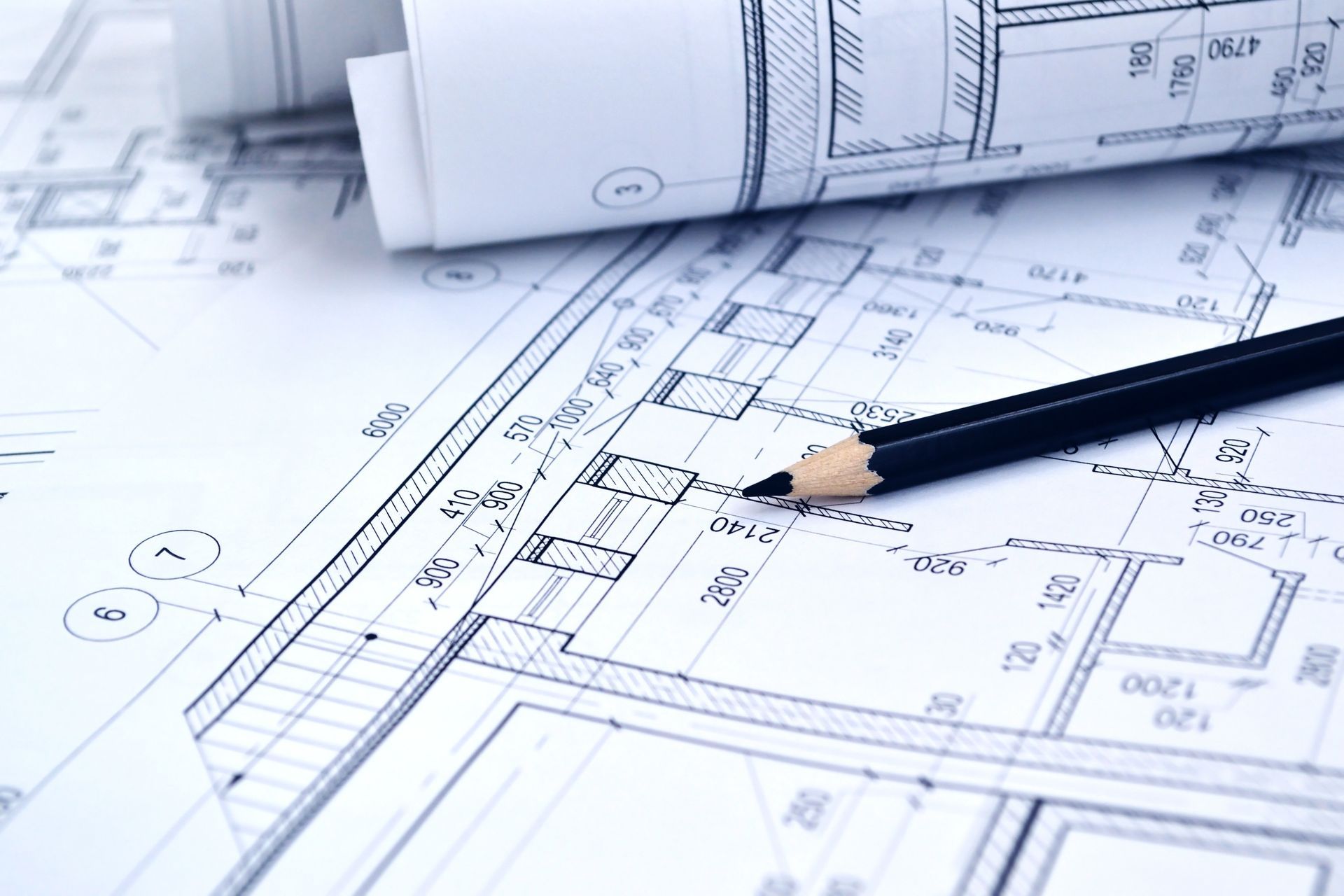 Architectural Blueprints With A Pencil Resting On Them — GS Design & Drafting In Ballina, NSW