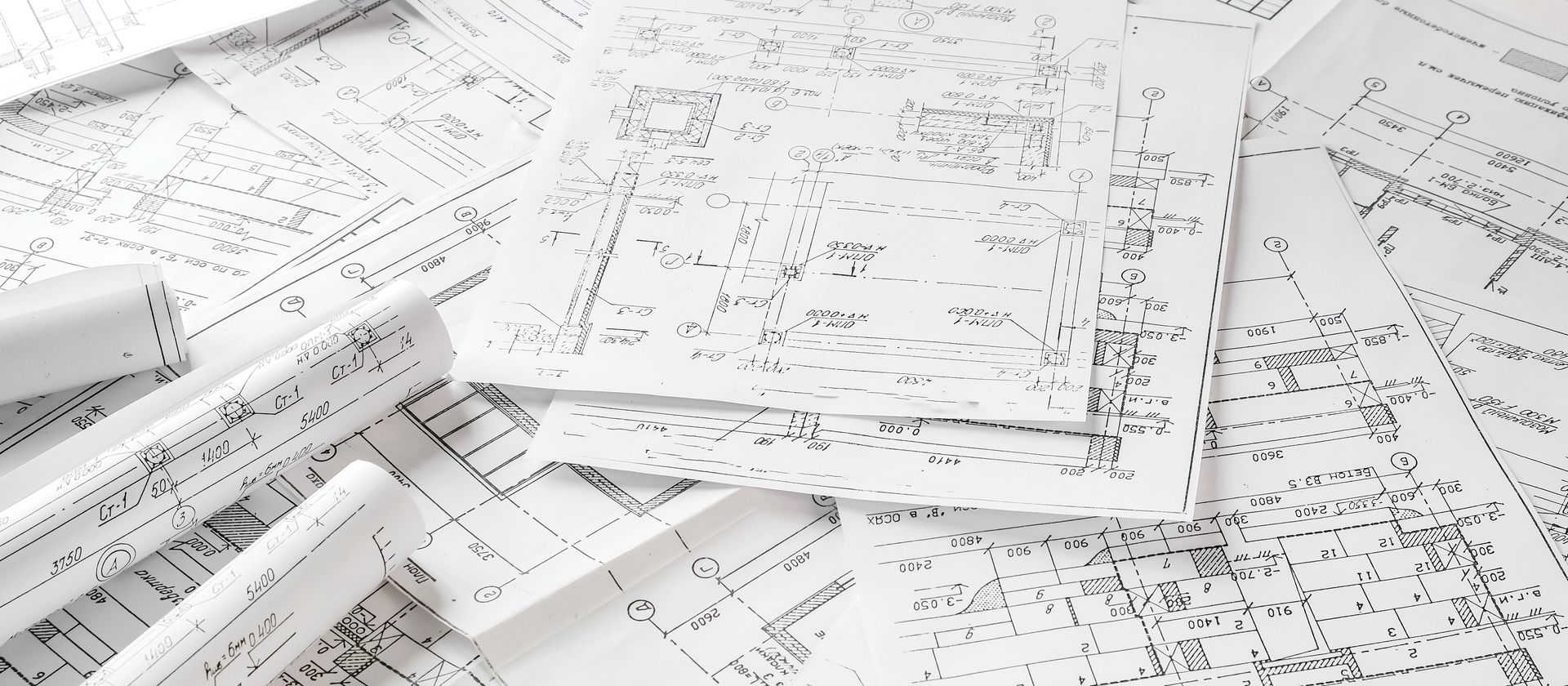 Architectural Blueprints Scattered On A White Surface — GS Design & Drafting In Rous, NSW