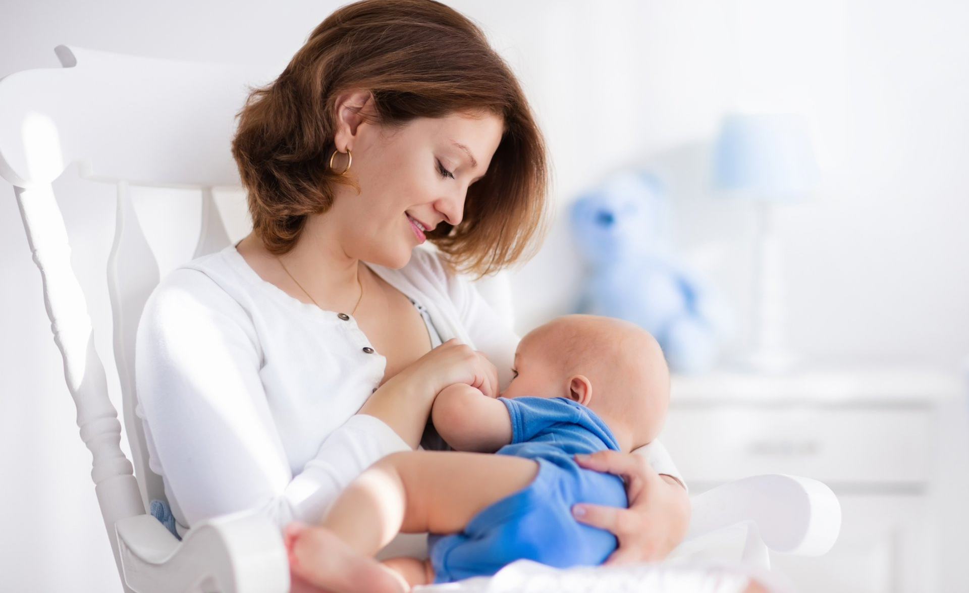 Woman Breastfeeding Child in Niagara Falls, NY Nursery