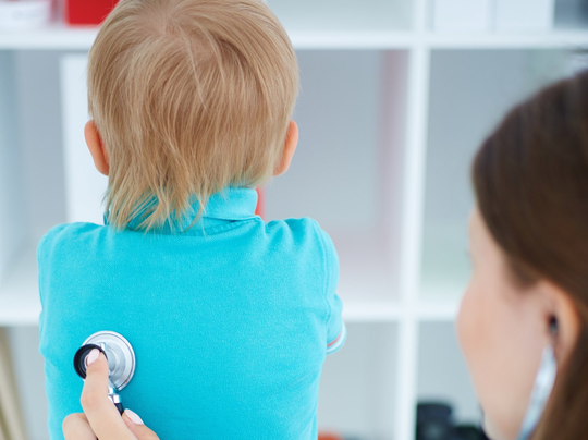 Pediatrician Checking Child's Breathing