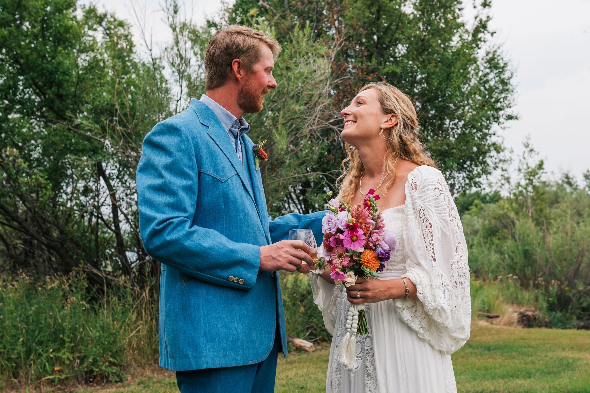 Bride and groom with outdoor backdrop