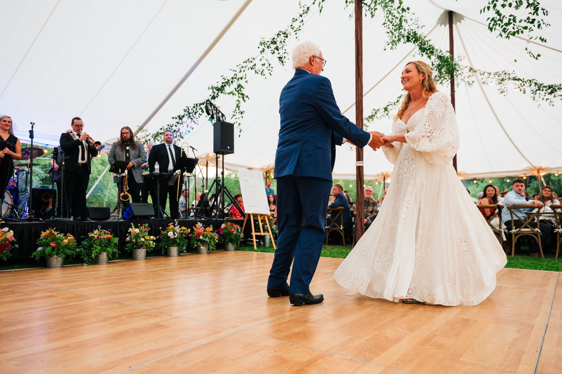 bride and father dance in outdoor venue