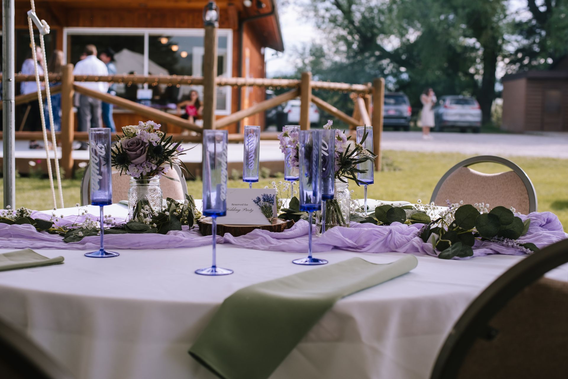 Outdoor venue with tent and dinner setting