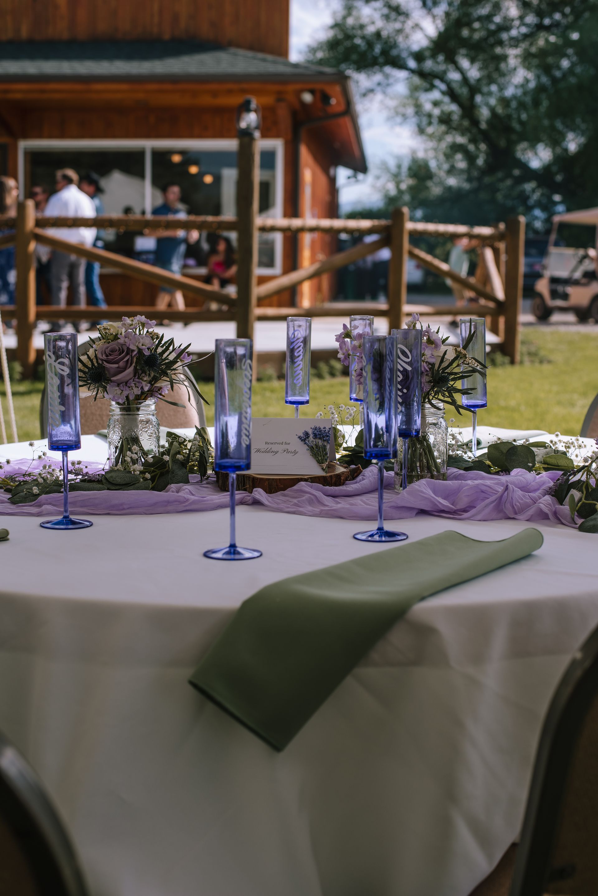 Outdoor venue with tent and dinner setting