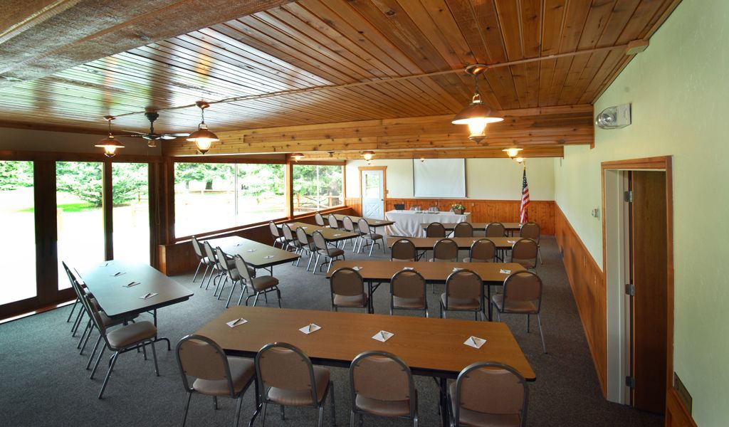 A large room with tables and chairs in it