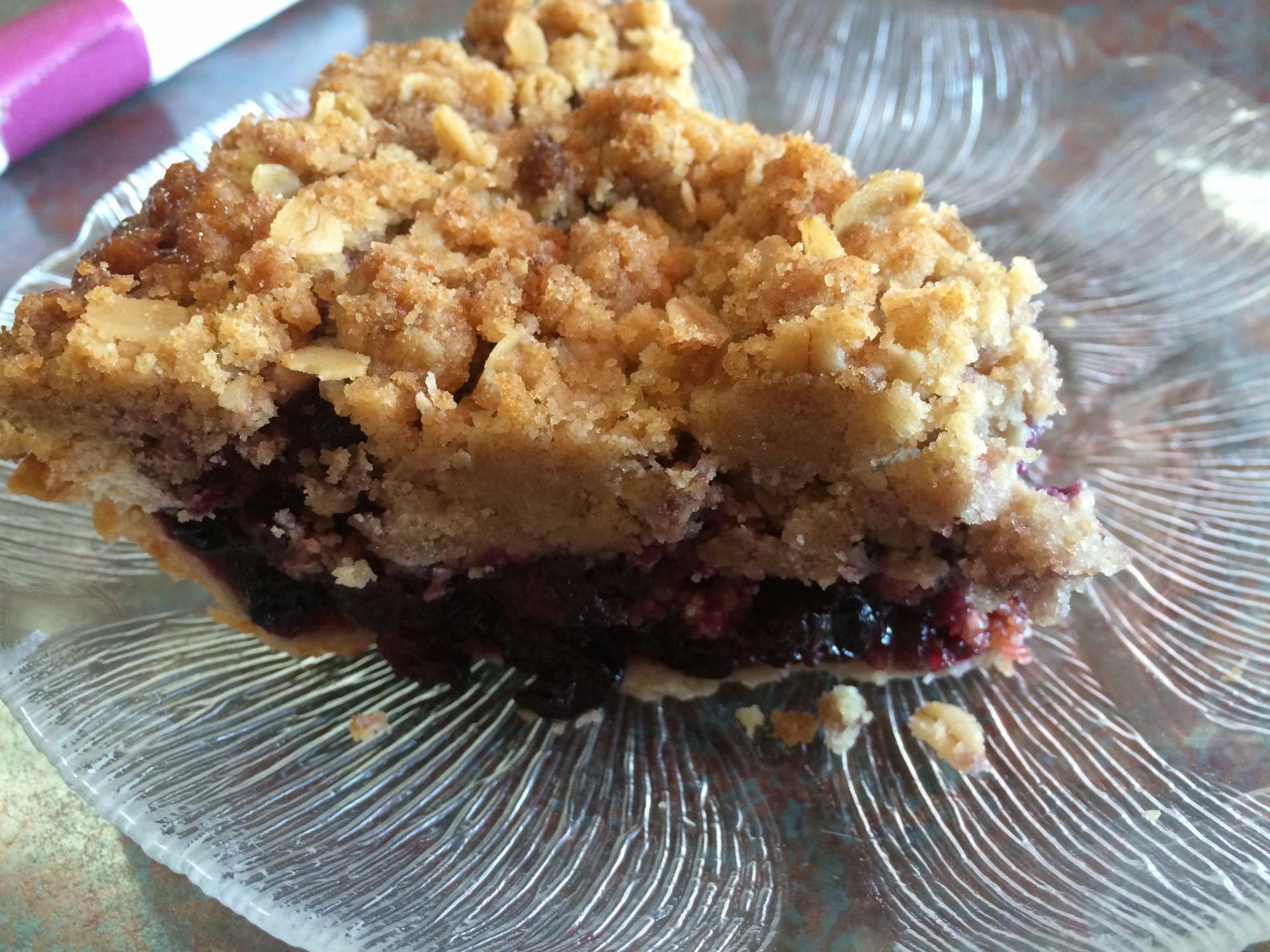 A close up of a piece of pie on a glass plate