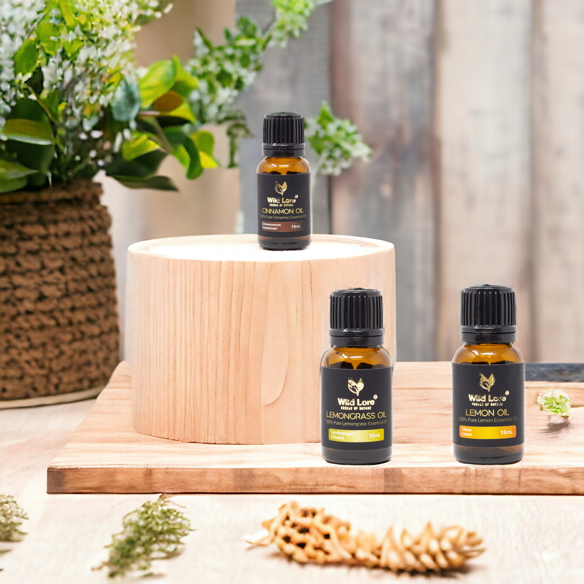Three bottles of essential oils are sitting on a wooden table