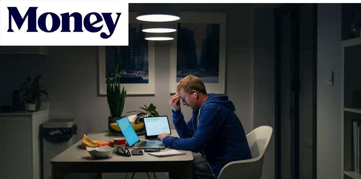 Man at kitchen table working on laptop and papers at night, reflecting saving vs mortgage decisions