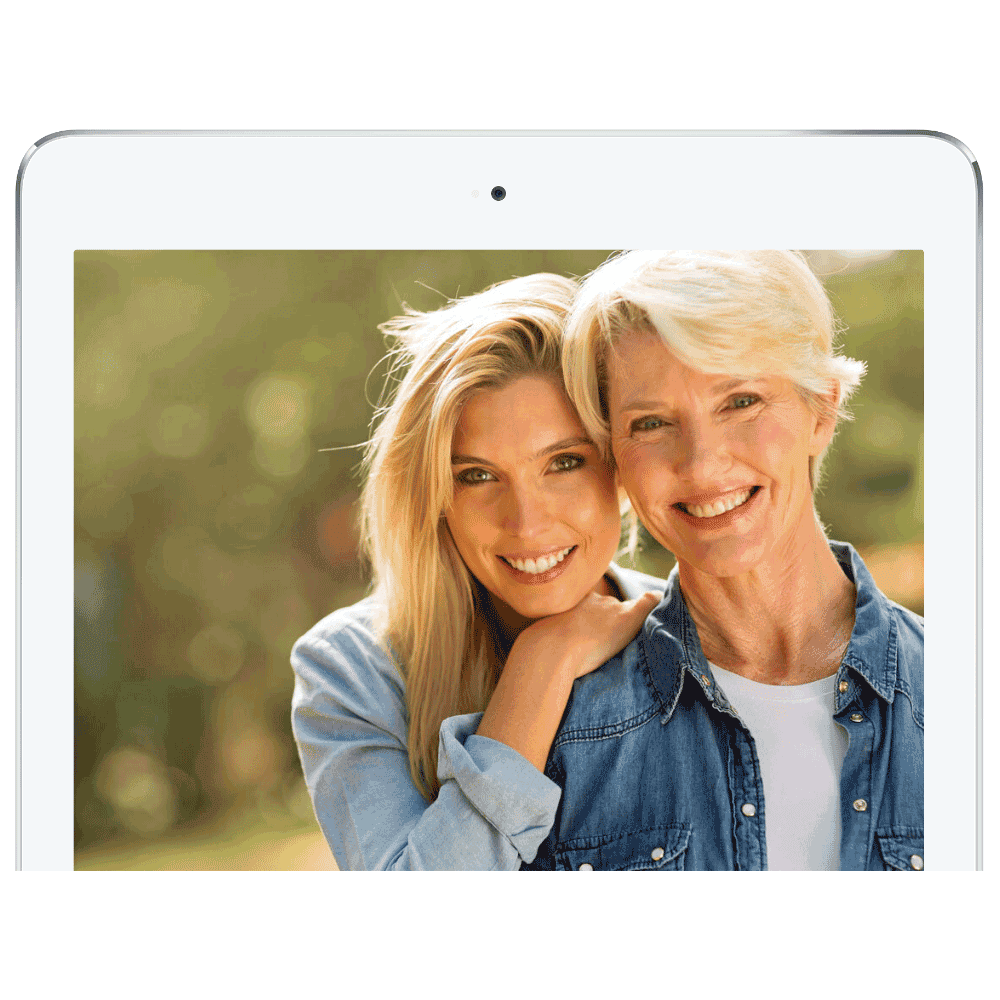 A photo of two women are posing for a picture on a tablet.