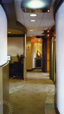 A photo of a hallway at Envisia with a computer on the desk.