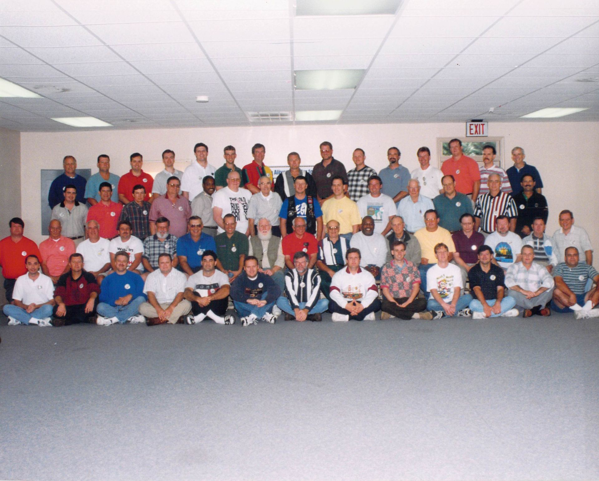 A large group of men are posing for a picture