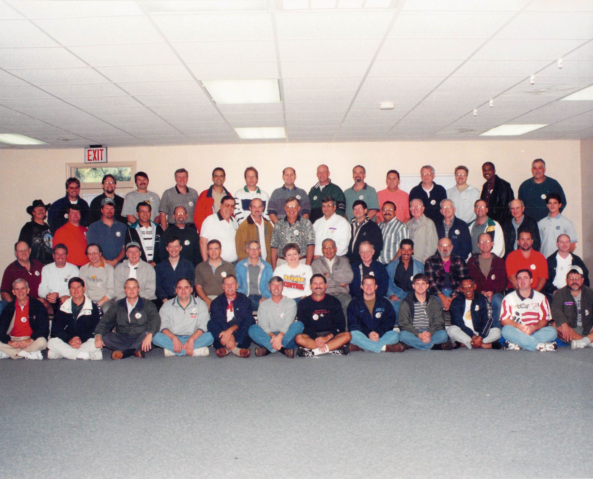 A large group of men are posing for a picture