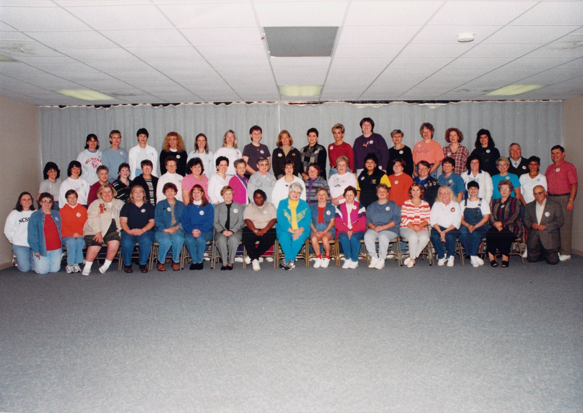 A large group of people are posing for a picture