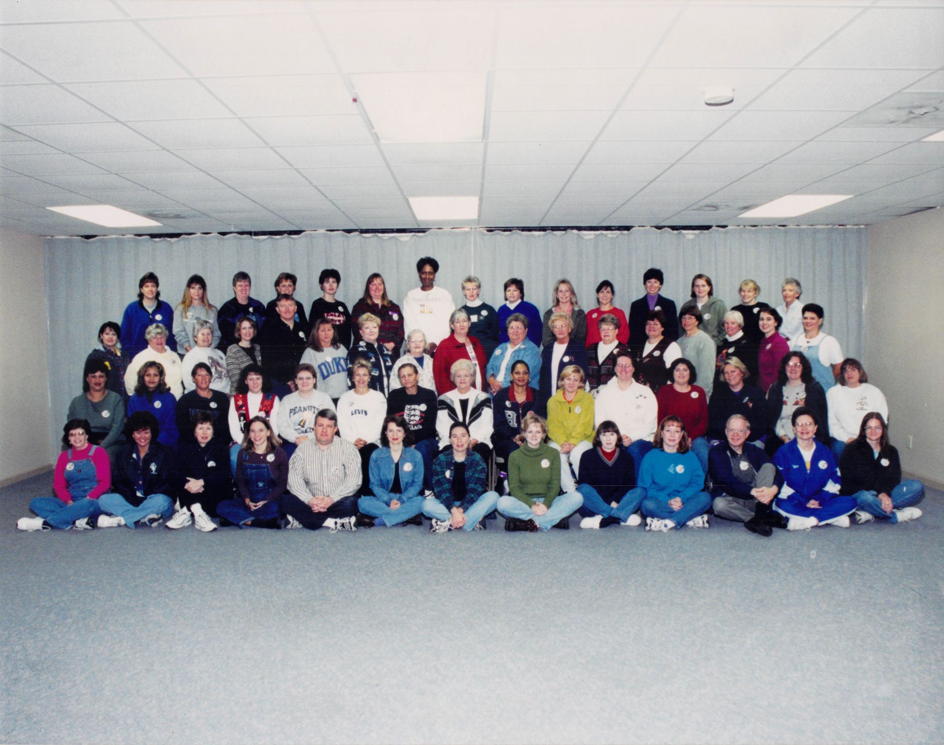A large group of people are posing for a picture