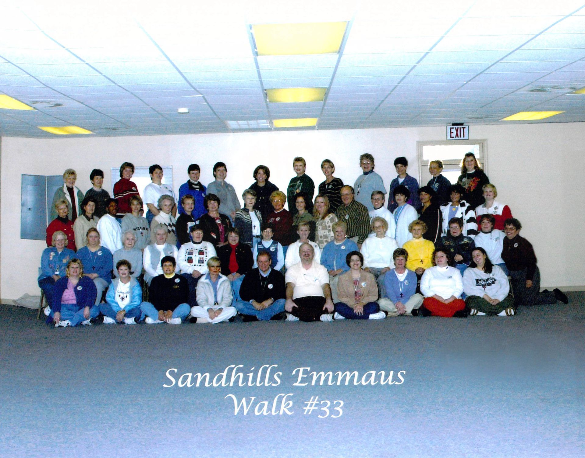 A large group of people are posing for a photo at sandhills emmaus walk # 33