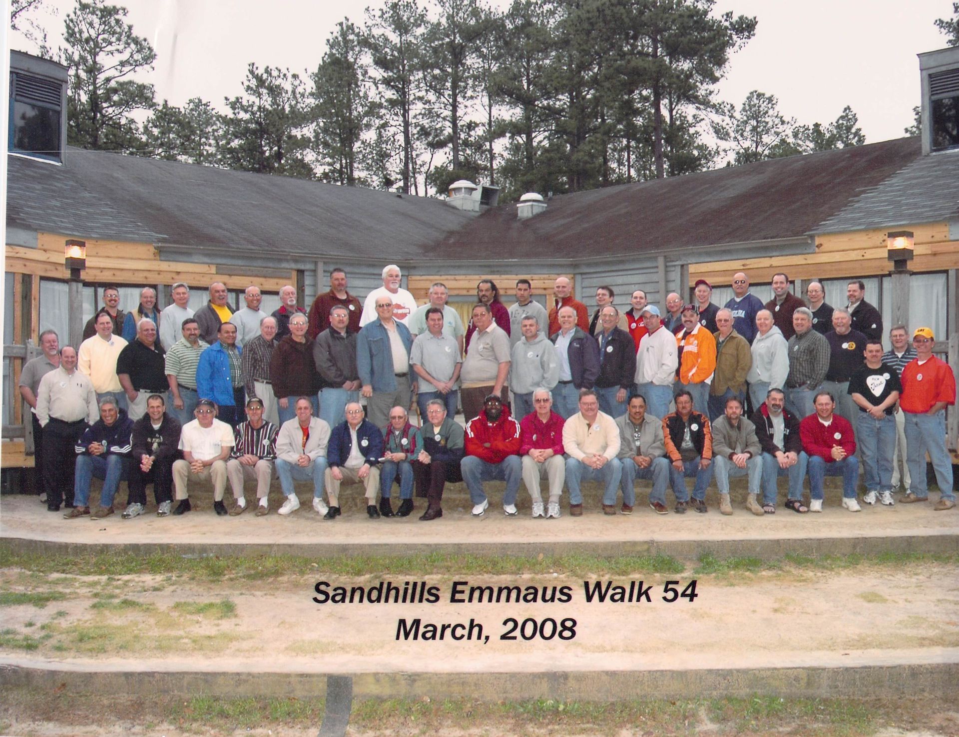 A group of men are posing for a photo at sandhills emmaus walk 54 march 2008