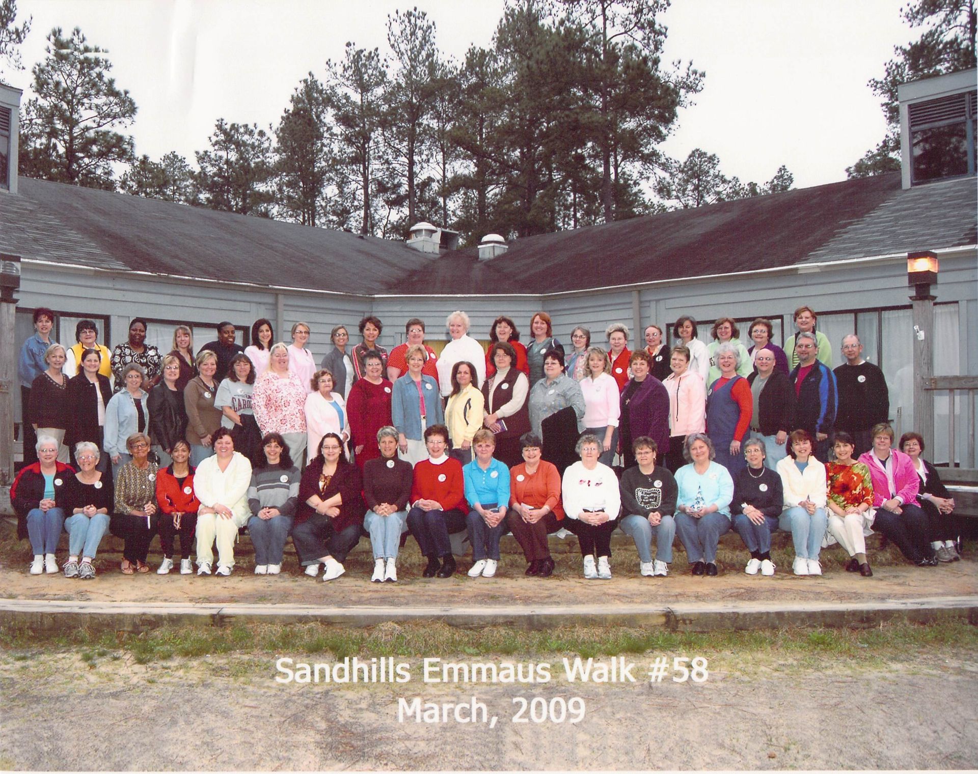 A large group of people are posing for a photo at sandhills emmaus walk # 58 march 2009