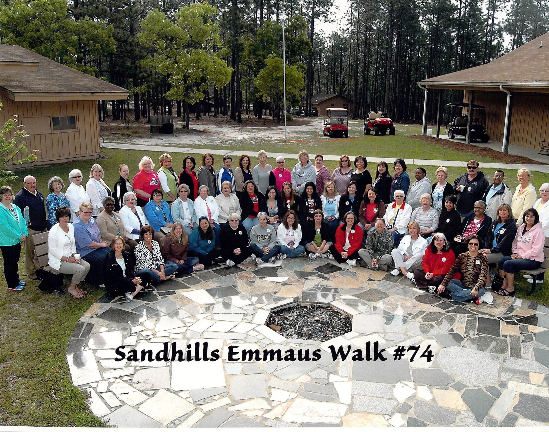 A large group of people are posing for a photo at sandhills emmaus walk # 74