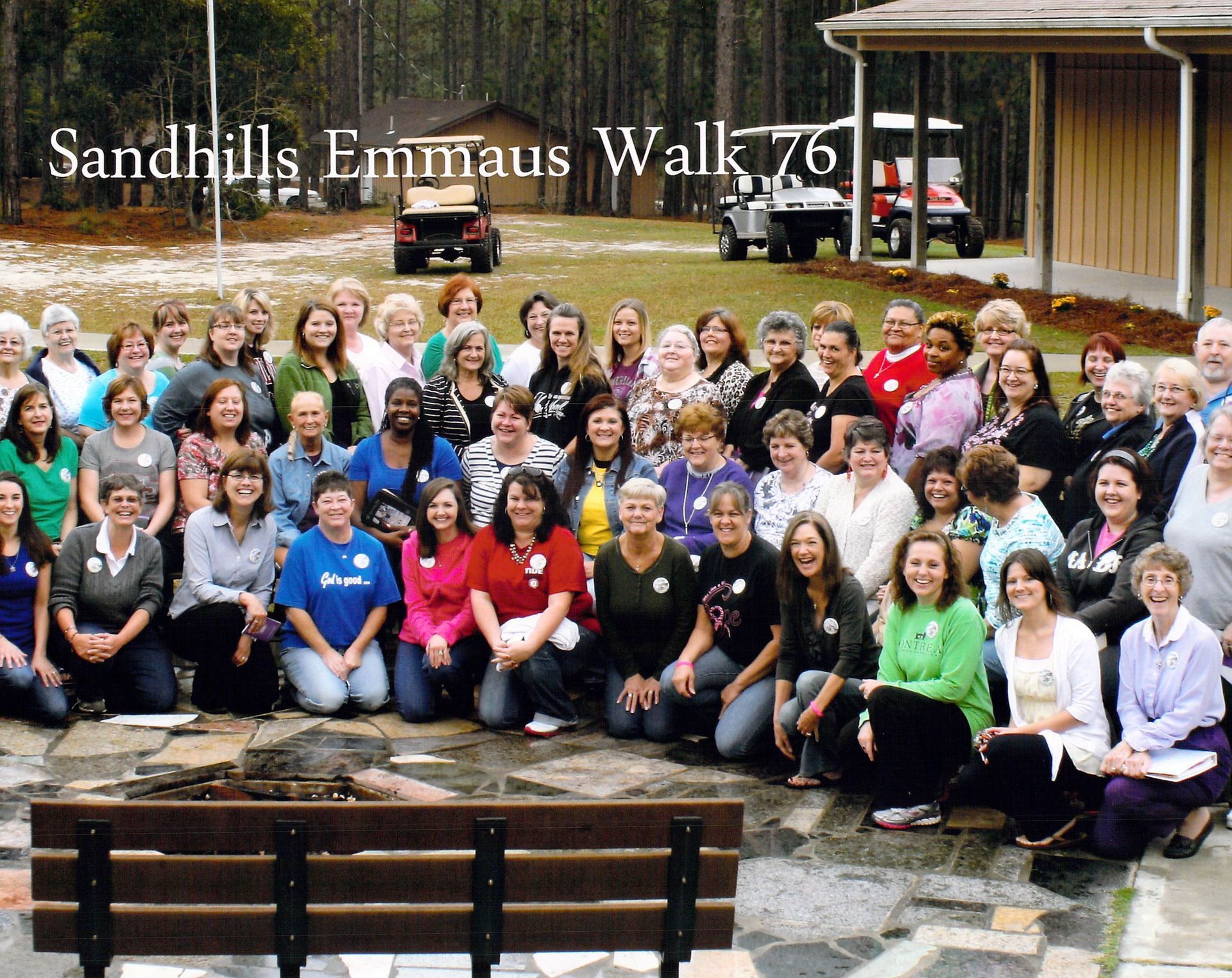 A large group of women are posing for a photo at sandhills emmaus walk 76