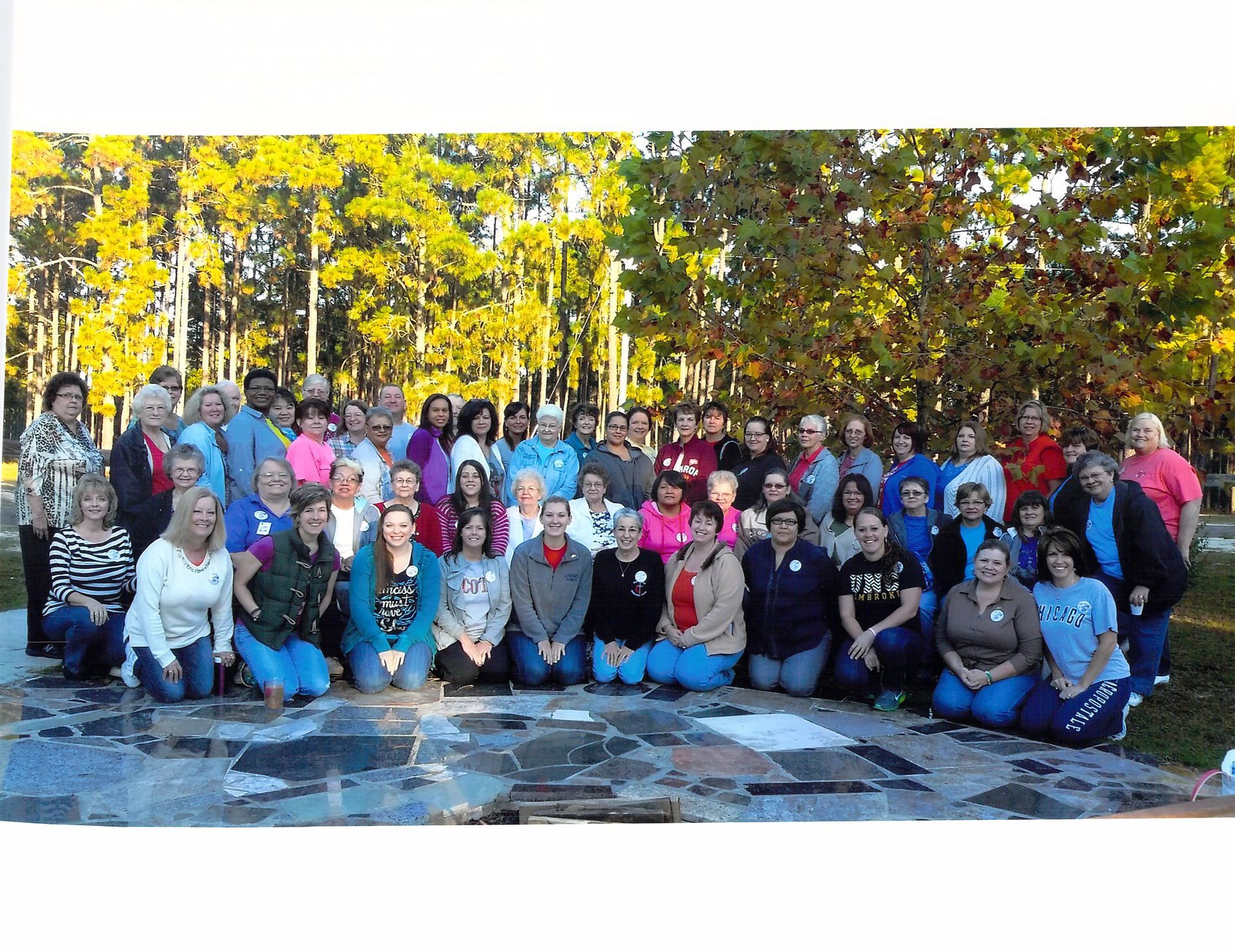 A large group of people are posing for a picture