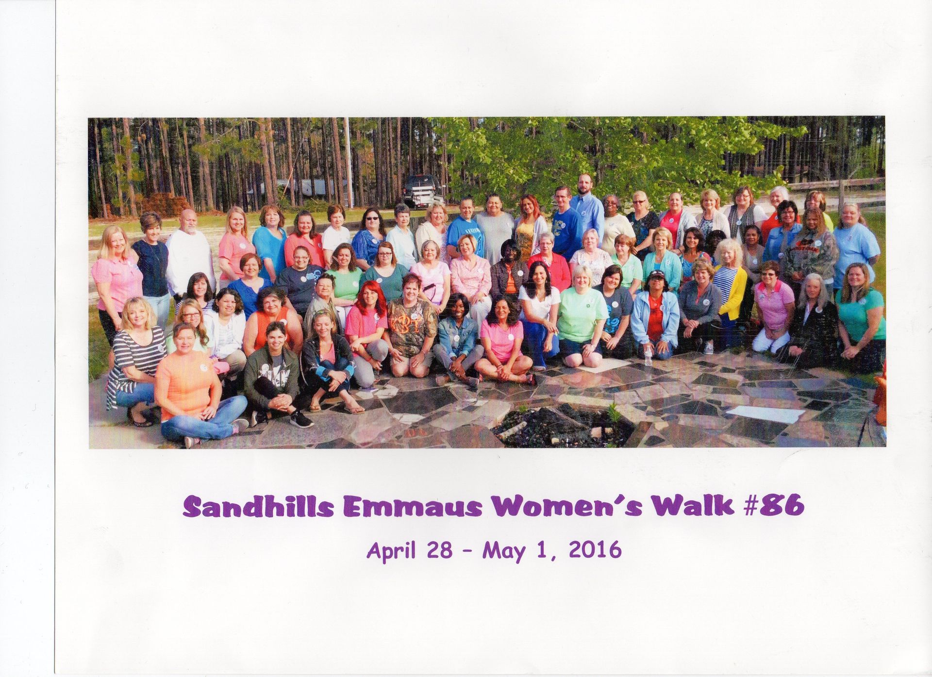 A group of people are posing for a photo at the sandhills emmaus women 's walk