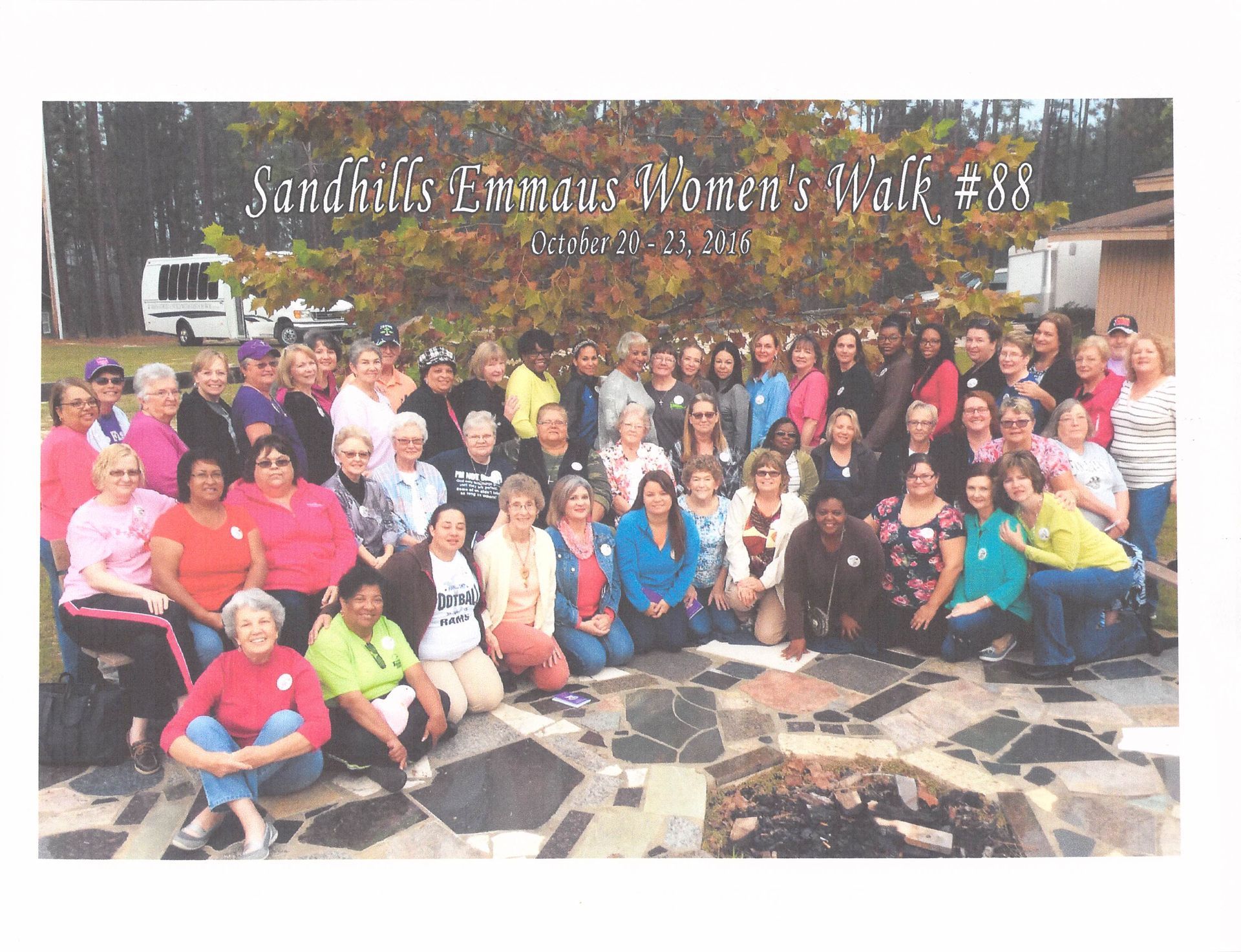A large group of people are posing for a picture with the words sandhills emmaus women 's walk # 38 on the bottom