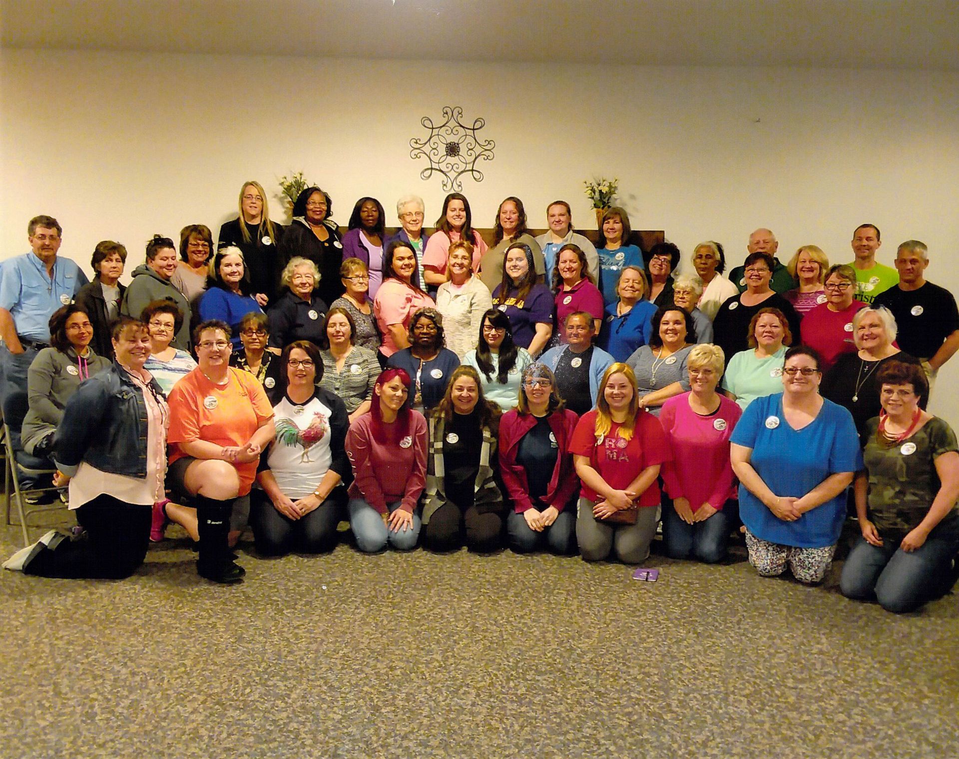 A large group of people are posing for a picture